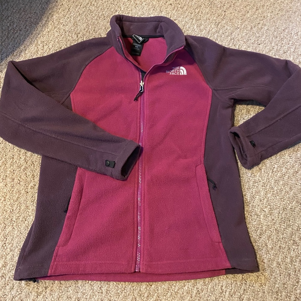 Pink and purple North Face zip-up winter jacket
